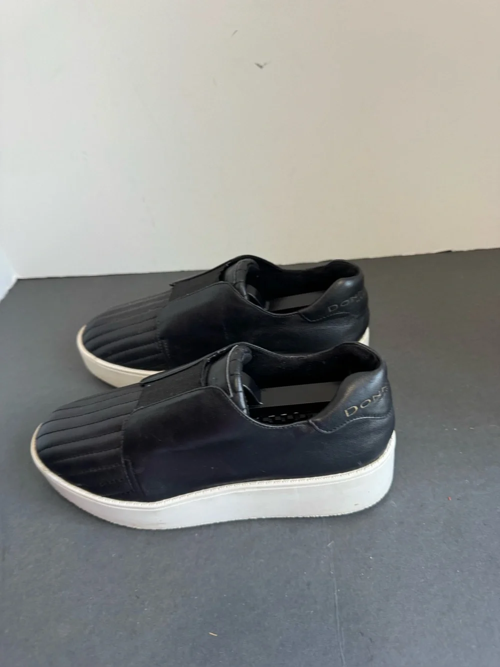 Donna Karan New York black leather slip-on sneakers. Size 6